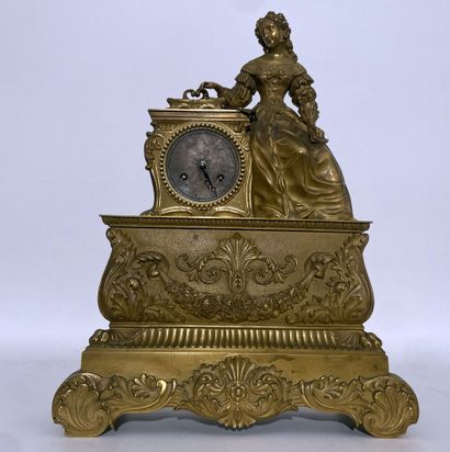 Gilt bronze clock decorated with a young...