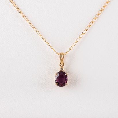 null 18 K gold chain, gross weight: 1.4 g and ruby pendant, 14 K setting gross weight:...