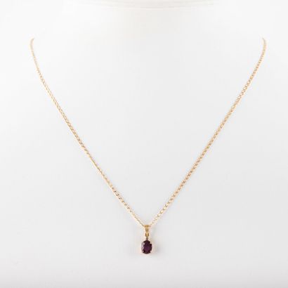 null 18 K gold chain, gross weight: 1.4 g and ruby pendant, 14 K setting gross weight:...