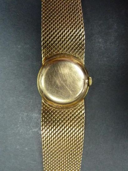 null OMEGA- montre de dame boitier et bracelet or, mouvement mécanique.
Vers 1960-70
Poids...