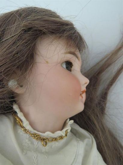 null Lot de deux poupées porcelaine :
- DEP SIMON-HALBIG, bouche ouverte, yeux basculant...