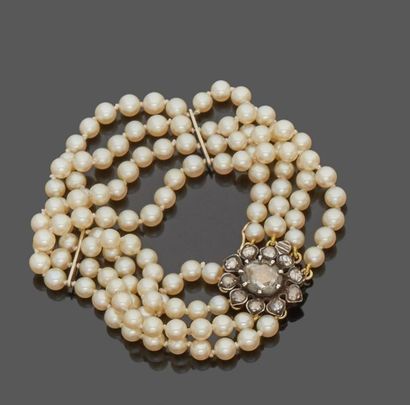 null Bracelet with four rows of cultured pearls, 18 k (750 thousandths) yellow gold...