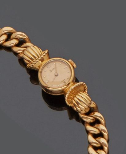 null 18 k (750 thousandths) yellow gold ladies' watch adorned with shells and scrolls,...