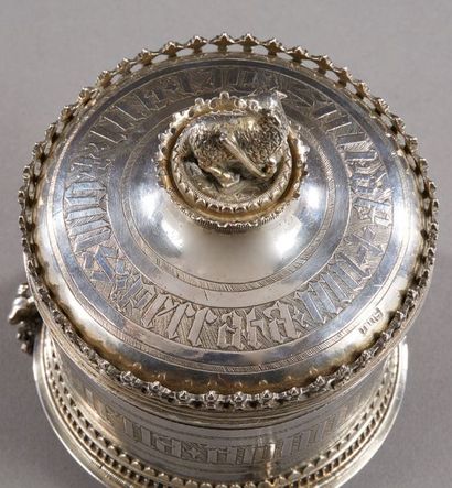 null FRANCE 15th century

A round silver host box, it rests on three feet featuring...