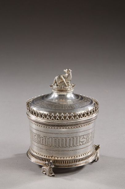 null FRANCE 15th century

A round silver host box, it rests on three feet featuring...