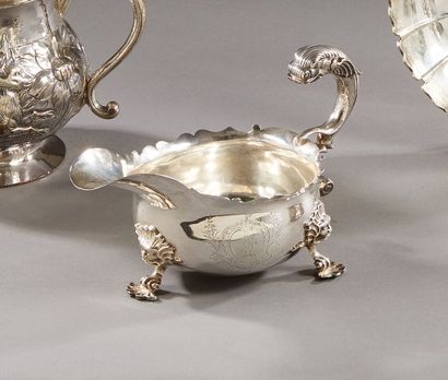 null LONDON 1743 - 1744

A shuttle-shaped silver sauce boat with a large spout resting...