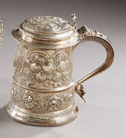 null Large silver covered mug with repoussé decoration of large fruit cartouches...