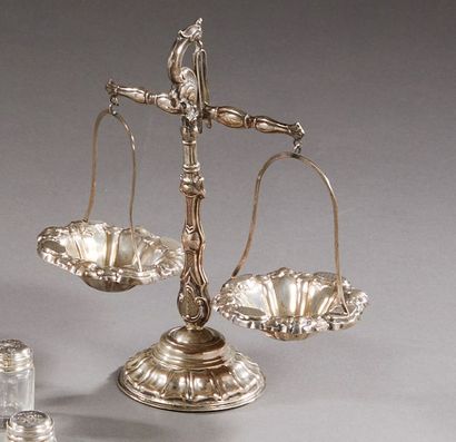 null Salt cellar in the shape of a silver scale with embossed flower and rockery...