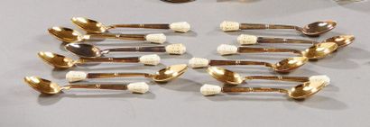 null A. PETER goldsmith

A series of twelve small vermeil spoons, handle with an...