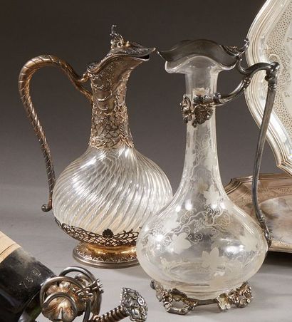 null Carafe in blown glass with twisted gadroons, silver setting with openwork decoration...