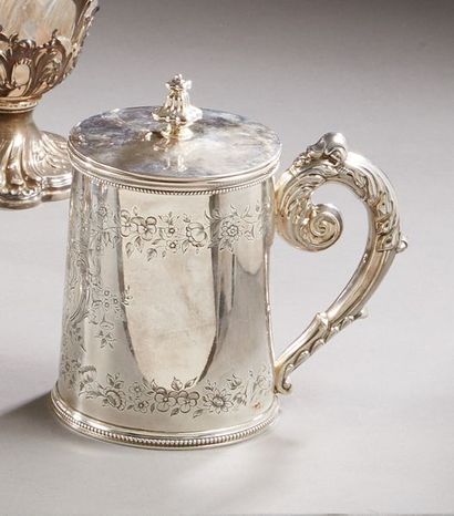 null Mug covered in silver, the conical body engraved with a decoration of flowery...