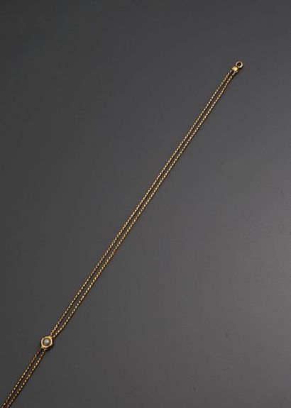 null Collier en or jaune 18 k (750 millièmes) à noeud coulissant orné d'une demi-perle...