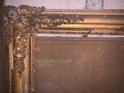 null Regency style wood and gilded stucco frame with openwork cartouche decoration...