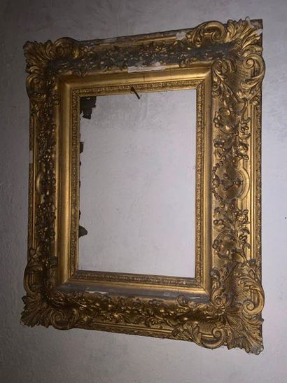 null Set of two frames, one in wood and gilded stucco with rich foliage decoration...