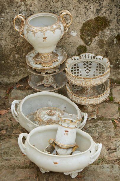 null White porcelain service part with gilded decoration of rocailles and foliage...