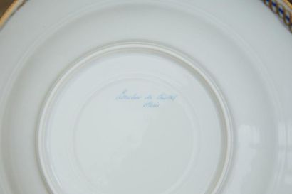 null A white porcelain dinner service part, the edges fretworked with a blue net...