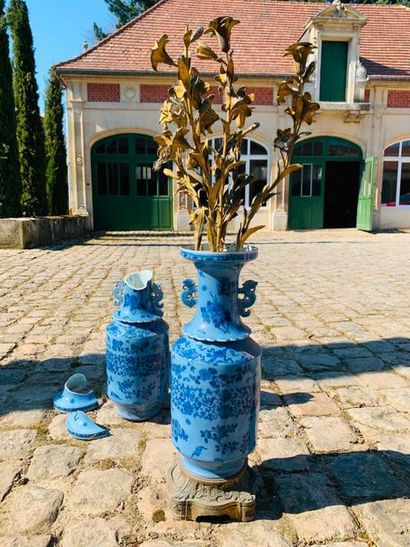 null CHINA - 19th century - Pair of blue enamelled porcelain open neck baluster vases...