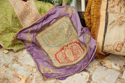 null Purple silk cushion, embroidered with floral motifs in gold threads in the centre...