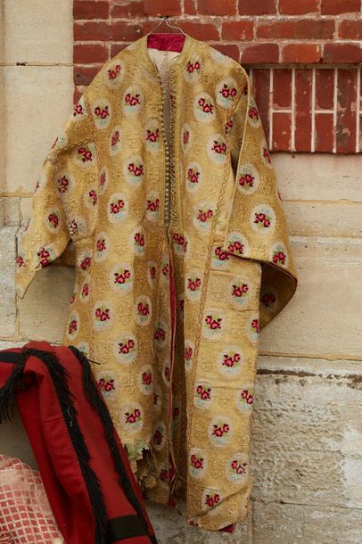 null Caftan embroidered with gold threads and red flower seedlings, bordered with...