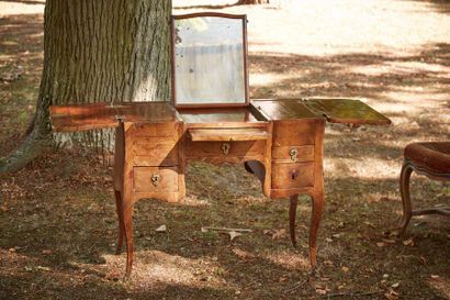 null Rosewood veneer dressing table opening by five drawers, two of which are simulated,...