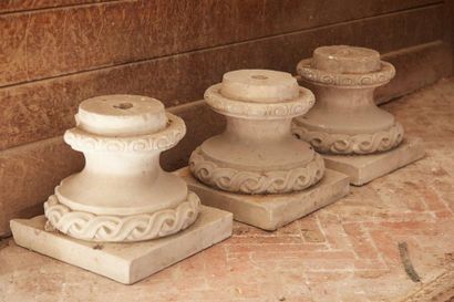 null Three terracotta pedestals, the square-section base topped by a round pedestal...