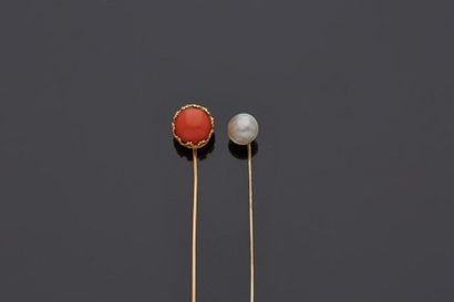 null Two 18 k (750 thousandths) yellow and white gold tie pins, one set with a coral...