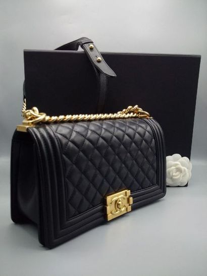 null CHANEL - "Boy" bag in black quilted leather, gold metal trim, with shoulder...