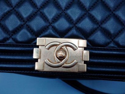 null CHANEL - "Boy" bag in black quilted leather, gold metal trim, with shoulder...