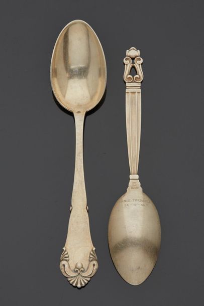 null Two spoons with different decorations of scrolls and miscellaneous, both engraved...