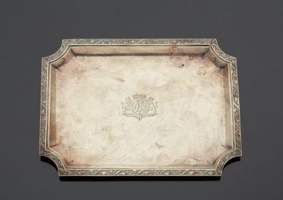 null Small rectangular silver card tray with curved corners, decorated on the wing...