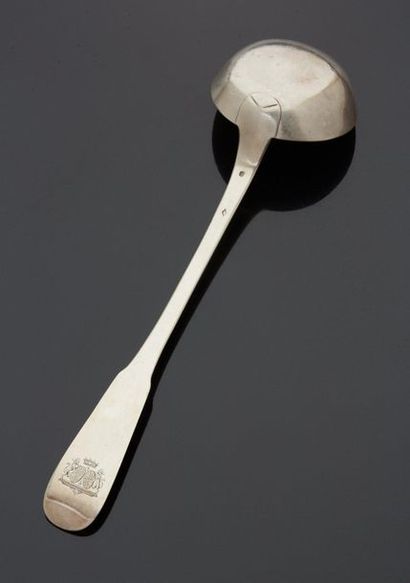 null A silver ladle, the spatula engraved with the coat of arms of the wedding band...