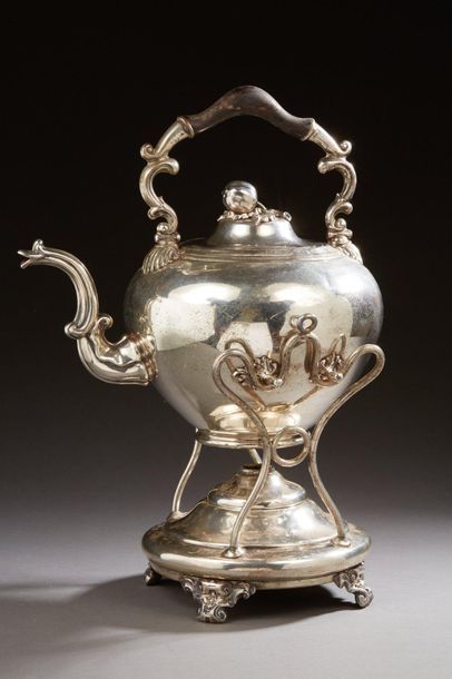 null Silver plated metal teapot with its stove decorated with shells, foliage and...