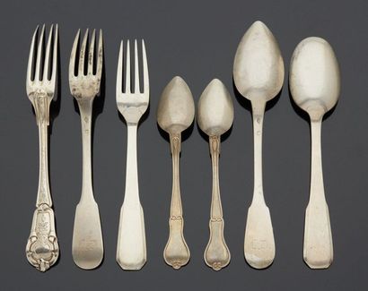 null Two pieces of silver cutlery (two forks and two spoons), one with a spatula...