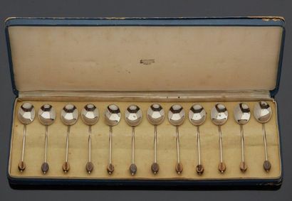 null Suite of twelve silver plated metal coffee spoons, the spatula decorated with...