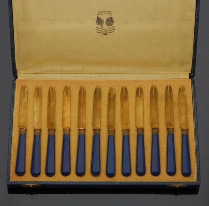 null Set of twelve seafood knives in gold plated metal with blue handles. In a case...