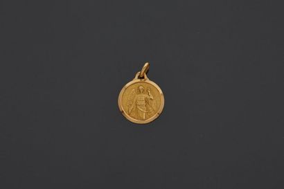 null 18 k (750 thousandths) round yellow gold medal, representing the Archangel Gabriel...