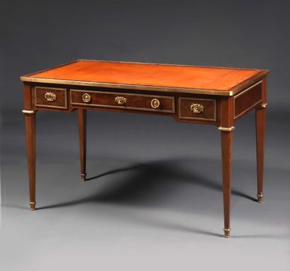 null Mahogany and mahogany veneer rectangular flat desk opening to three drawers...