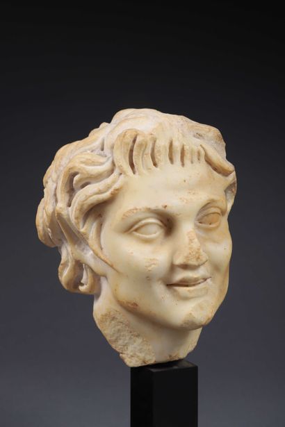 null 
Head of a young satyr (faun) with untidy hairstyle revealing pointed ears....