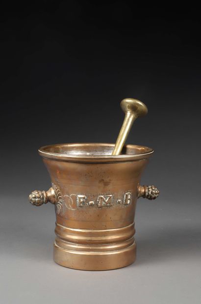 null Bronze mortar of truncated cone shape decorated with initials "F.M.B." and the...