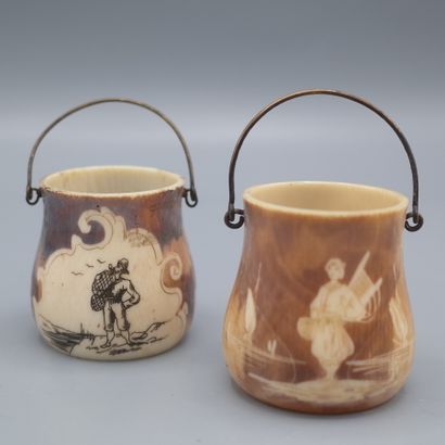 null Two small turned ivory pots with peach scenes, metal handles.

Work from Dieppe...