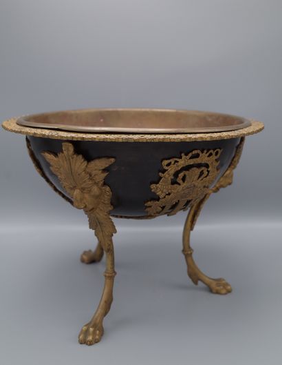 null Large tripod goblet in dark brown patinated bronze and gilt bronze, the foot...