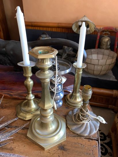 null Five candleholders, one of which is made of tin and a candleholder mounted as...