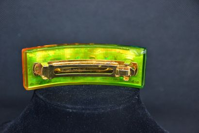  *CHANEL 
Large barrette made of an inclusion of resin tinted "rainbow", the letters...