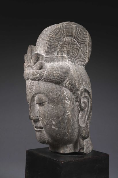 null Carved stone head representing a face with closed eyes.

Asian work

Height...