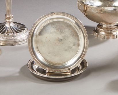 null Two silver coasters decorated with a frieze of palmettes. (small shocks).

Marked...