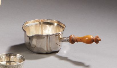 null MEURICE WHEAT.

A silver spouted frying pan with a contoured net pattern and...