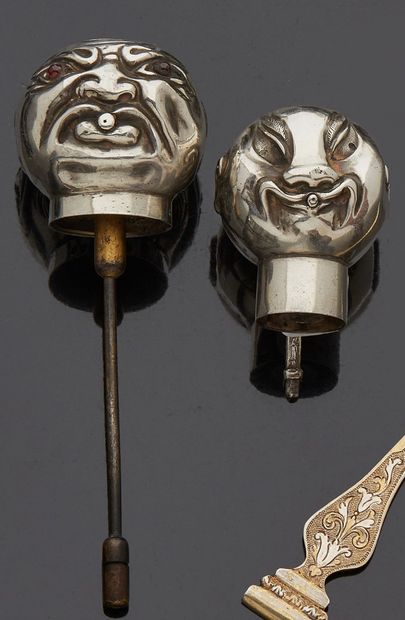 null Two silver spray heads in the shape of Chinese heads, one engraved with a monogram...