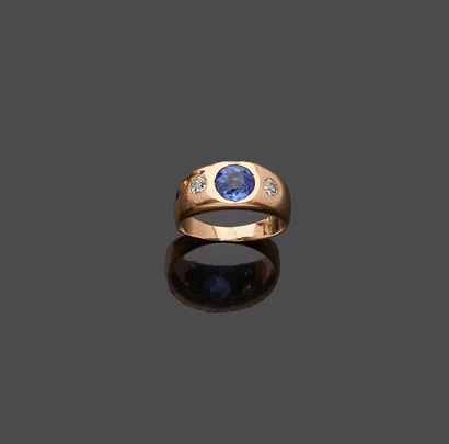 null Ring in pink gold 18 k (750 thousandths) set with a round sapphire with two...