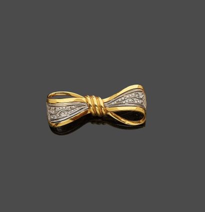 null Brooch knot in yellow and white gold 18 k (750 thousandths) set with small diamonds.

Gross...
