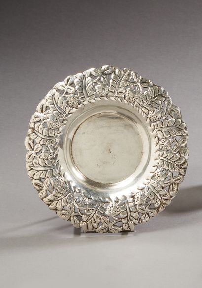 null Silver coaster with openwork decoration of foliage and strawberries.

Foreign...
